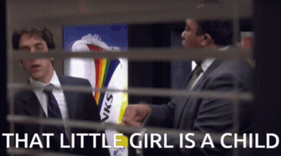 Man In Suit Talking Behind Girl GIF