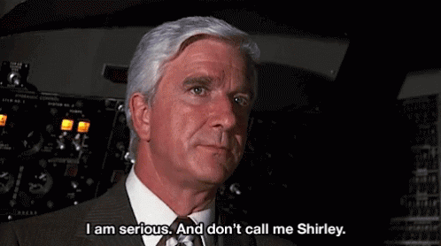 Man In Suit Talking In Cockpit GIF