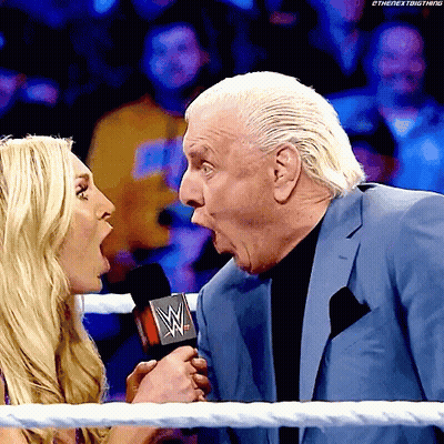 Man In Suit Talking Into Microphone GIF