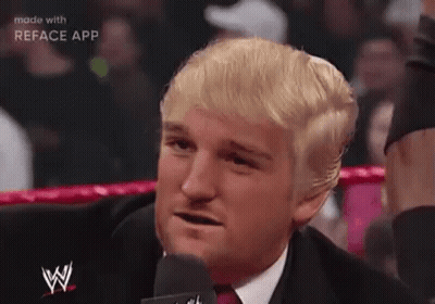 Man In Suit Talking Into Microphone In Ring GIF
