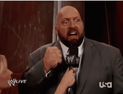 Man In Suit Talking Into Microphone Making Funny Face GIF