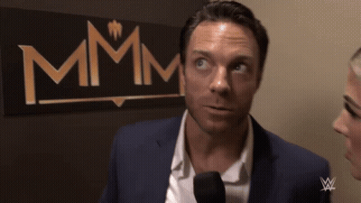 Man In Suit Talking Into Microphone Sign Says Mmmm GIF