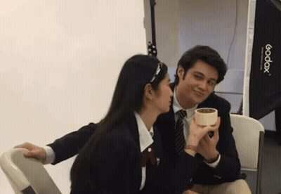Man In Suit Talking Into Microphone Smiling GIF