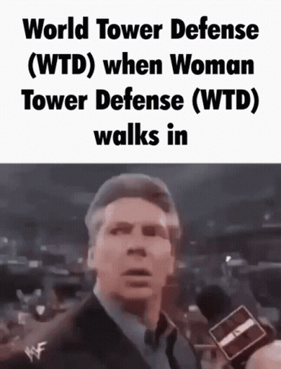Man In Suit Talking Into Microphone Wearing World Tower Defense T-Shirt GIF