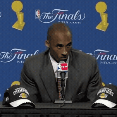 Man In Suit Talking Into Microphone What's There To Be Happy About GIF