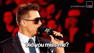 Man In Suit Talking Into Microphone With Sunglasses GIF