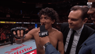 Man In Suit Talking Into UFC Microphone GIF