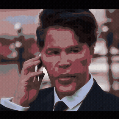 Man In Suit Talking On Cell Phone GIF