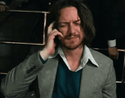 Man In Suit Talking On Cell Phone While Sitting GIF