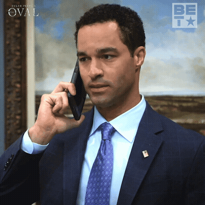 Man In Suit Talking On Cell Phone With Oval Background GIF