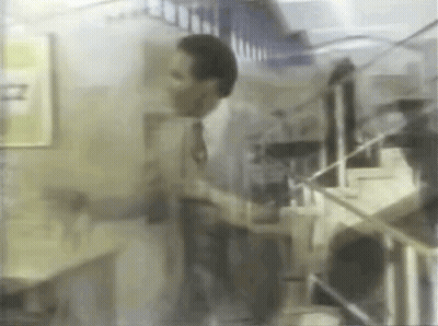 Man In Suit Talking On Cell Phone GIF