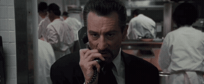 Man In Suit Talking On Phone GIF