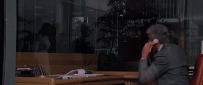 Man In Suit Talking On Phone GIF