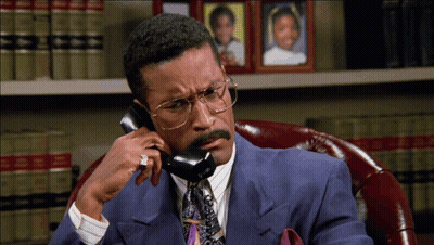Man In Suit Talking On Phone GIF