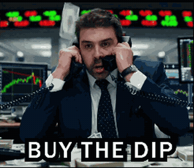 Man In Suit Talking On Phone Saying Buy The Dip GIF