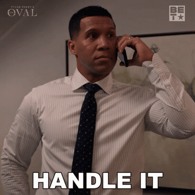 Man in Suit Talking on Phone Saying Handle It