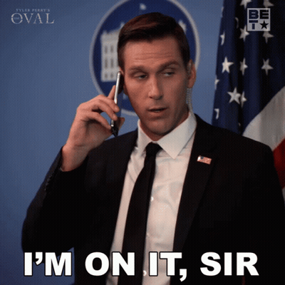 Man In Suit Talking On Phone Saying I'm On It Sir GIF