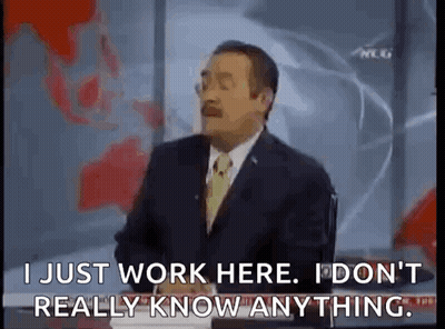 Man In Suit Talking On Television GIF