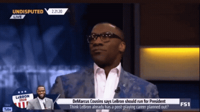 Man In Suit Talking On TV Show GIF
