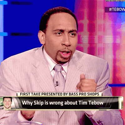 Man In Suit Talking On TV Show GIF