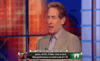 Man In Suit Talking On TV GIF