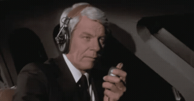 Man In Suit Talking On Walkie Talkie Roger GIF