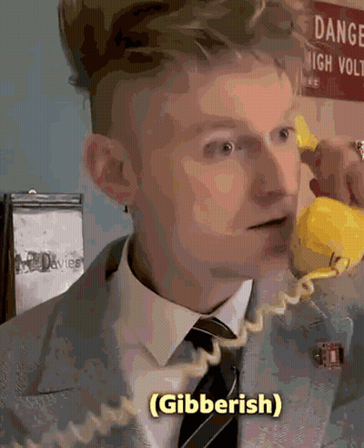 Man In Suit Talking On Yellow Phone GIF
