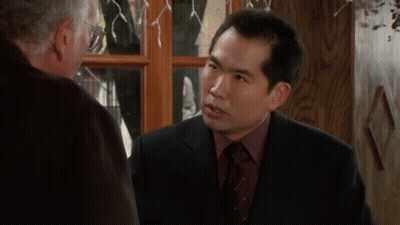 Man In Suit Talking To Another Man GIF