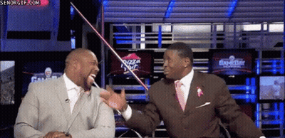 Man In Suit Talking To Another Man By Pizza Hut Sign GIF