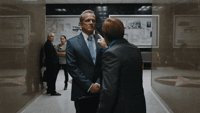 Man In Suit Talking To Another Man GIF