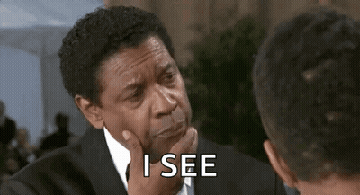 Man In Suit Talking To Another Man Hand On Chin GIF