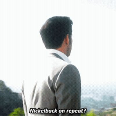 Man In Suit Talking To Another Man In Front Of Mountain GIF