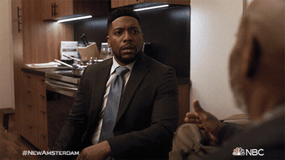 Man In Suit Talking To Another Man In Kitchen NBC GIF