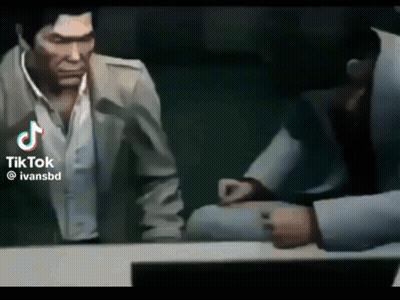 Man in Suit Talking to Another Man in Video Game