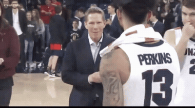 Man In Suit Talking To Basketball Player 13 GIF