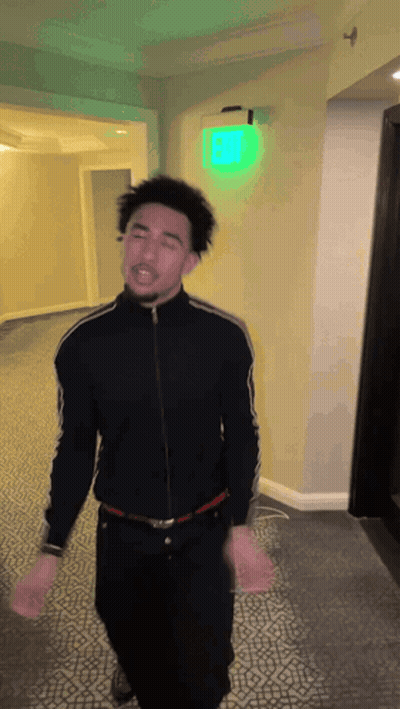 Man In Suit Talking To Basketball Player Number 3 GIF