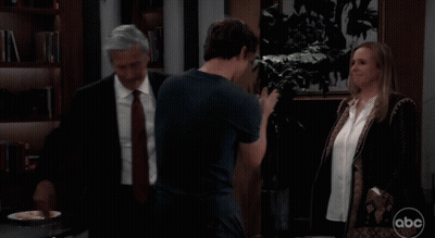 Man In Suit Talking To Boy And Woman With ABC GIF