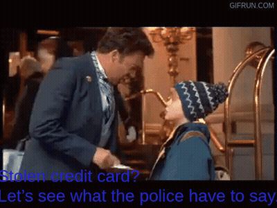 Man In Suit Talking To Boy In Beanie Holding Credit Card GIF