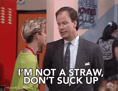 Man In Suit Talking To Boy In Green Shirt GIF