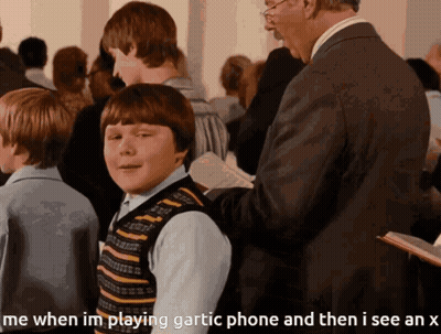 Man In Suit Talking To Boy In Striped Vest Playing Gartic Phone GIF