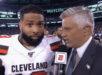 Man In Suit Talking To Cleveland Player GIF