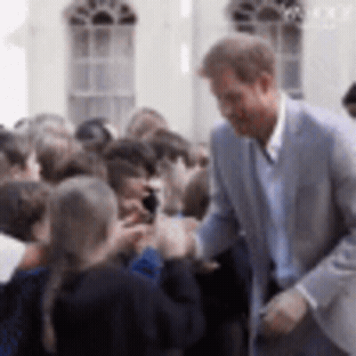 Man In Suit Talking To Group GIF