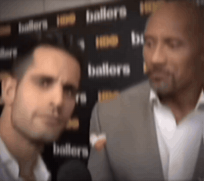 Man In Suit Talking To Man GIF