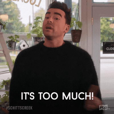 Man In Suit Talking To Man In Blue Shirt GIF