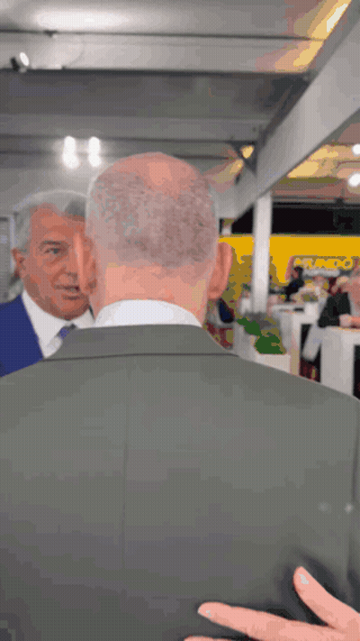 Man In Suit Talking To Man In Blue Suit GIF