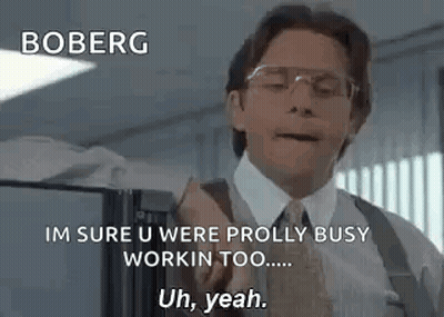 Man In Suit Talking To Man In Cubicle GIF