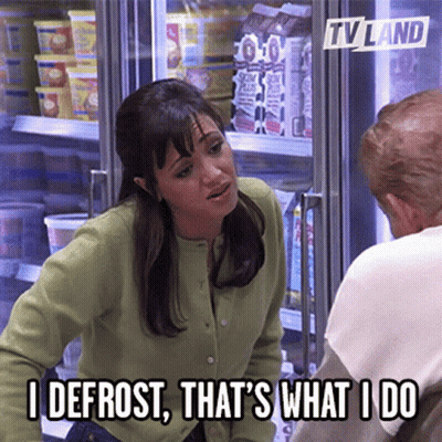 Man In Suit Talking To Man In Field GIF