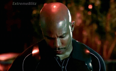 Man In Suit Talking To Man In Plaid Shirt GIF