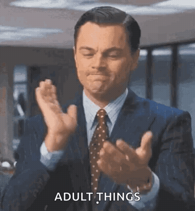 Man In Suit Talking To Man In White Shirt GIF