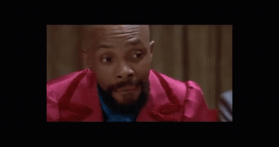 Man In Suit Talking To Man In White Shirt GIF
